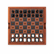 Iron & Glory Checkmate chess set, top down with black and white pieces, grey background