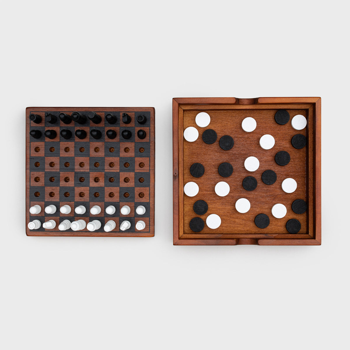 Iron & Glory Checkmate box open beside the board set up for checkers