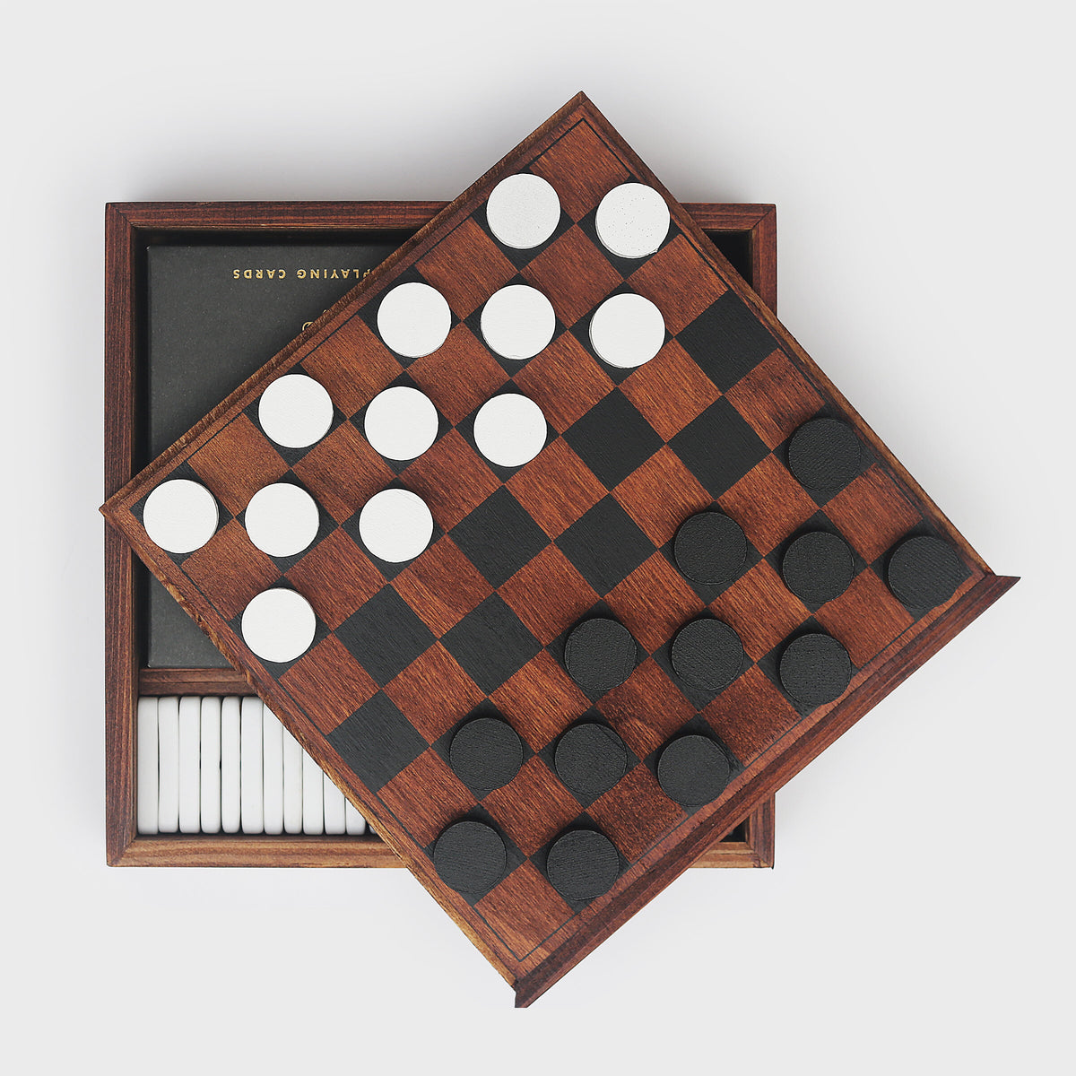 Games Night compendium with checkerboard lid and checkers on top of the box