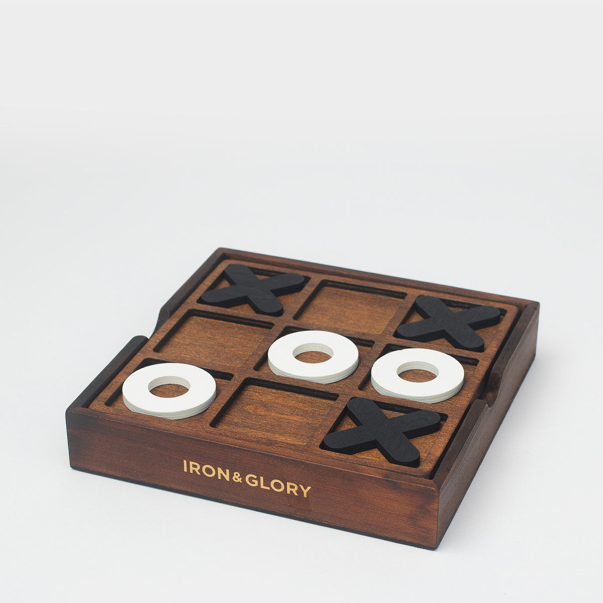 Iron & Glory noughts and crosses board at an angle with white noughts