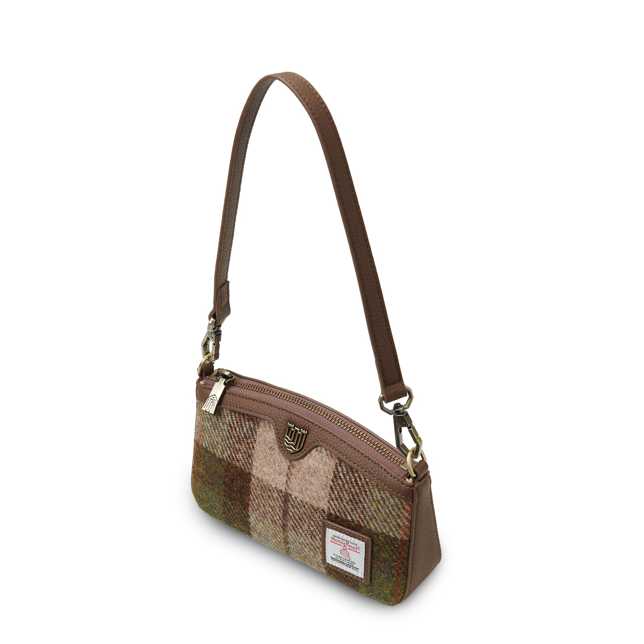 Close-up of chestnut tartan Harris Tweed texture and brown leather trim