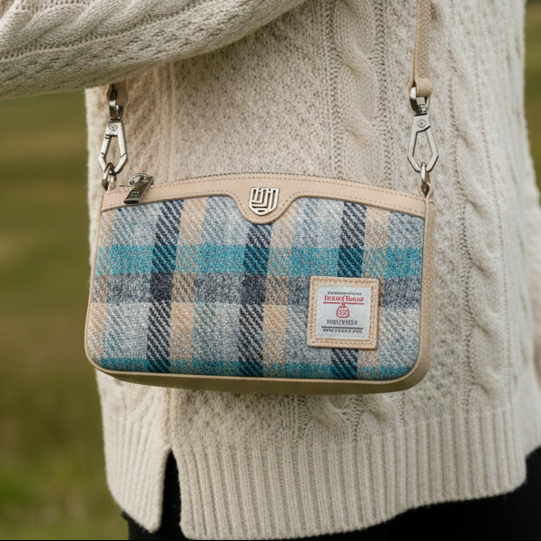 Ailsa Islander tartan Harris Tweed purse in blue teal worn crossbody outdoor