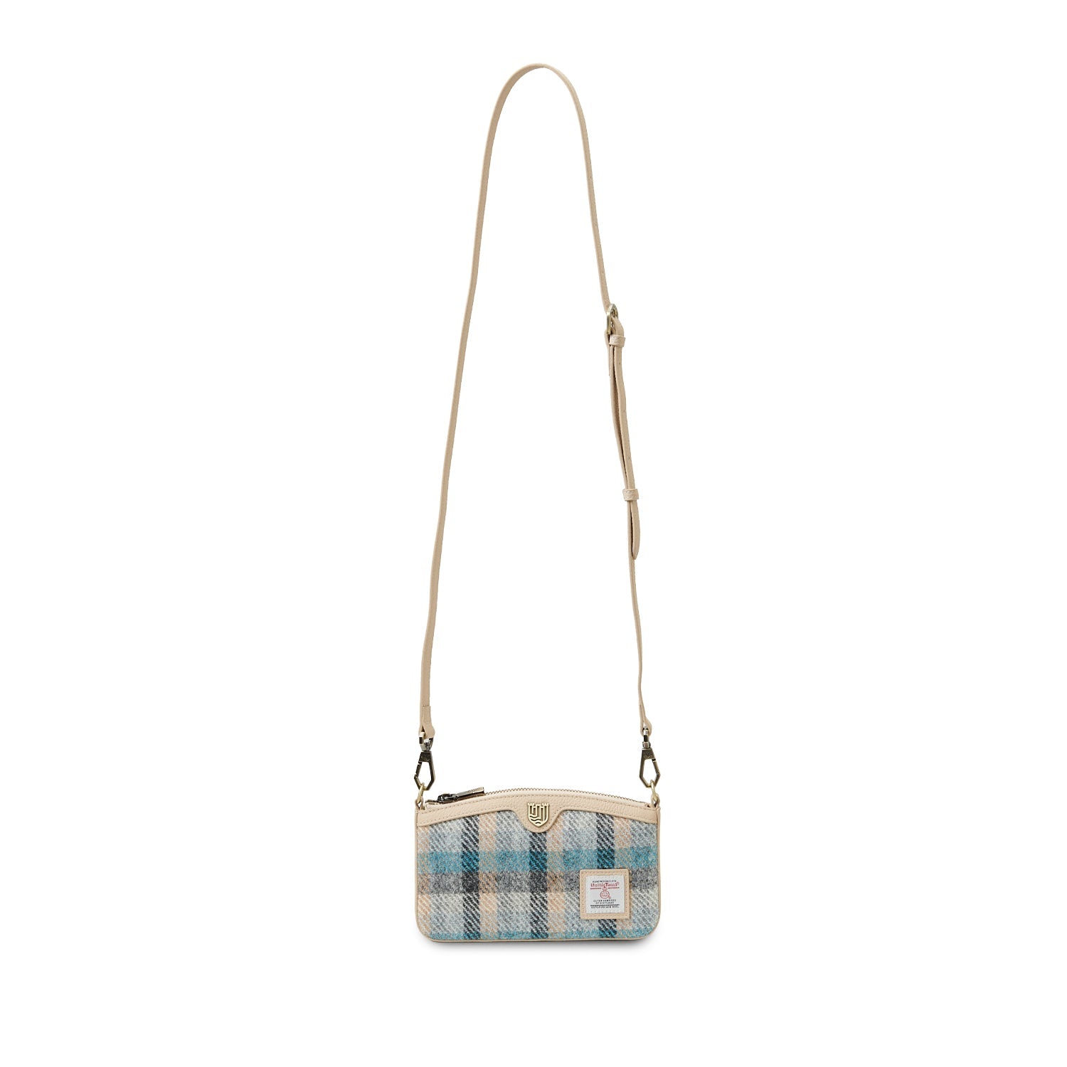 Ailsa Islander tartan purse lifestyle shot with cream cable-knit jumper