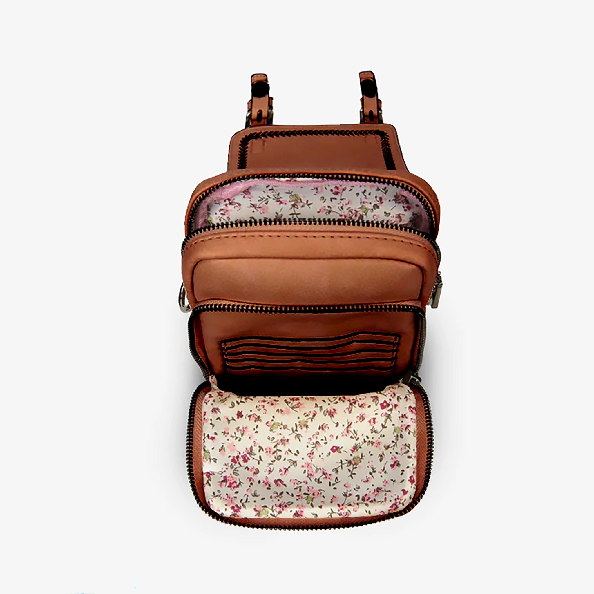 Islander crossbody bag interior open showing floral lining and card slot pocket