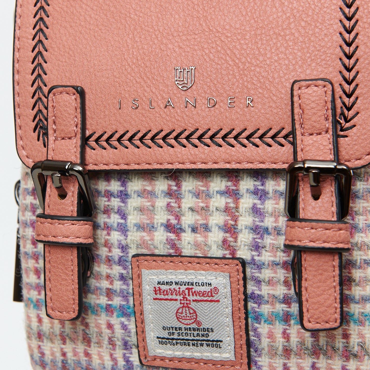 Harris Tweed orb label on the pink and purple mini dogtooth Baby Jura crossbody