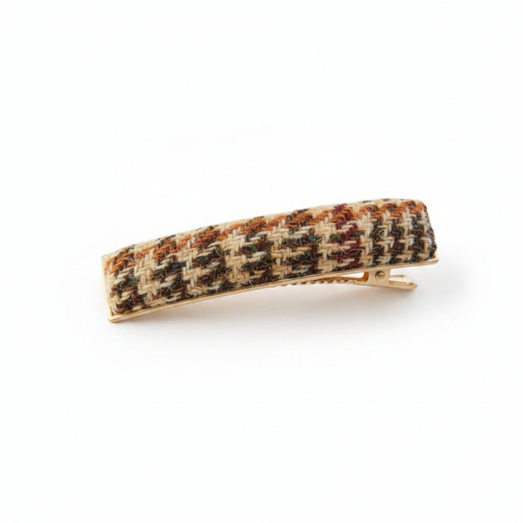 Beige dogtooth Harris Tweed barrette clip angled on white background