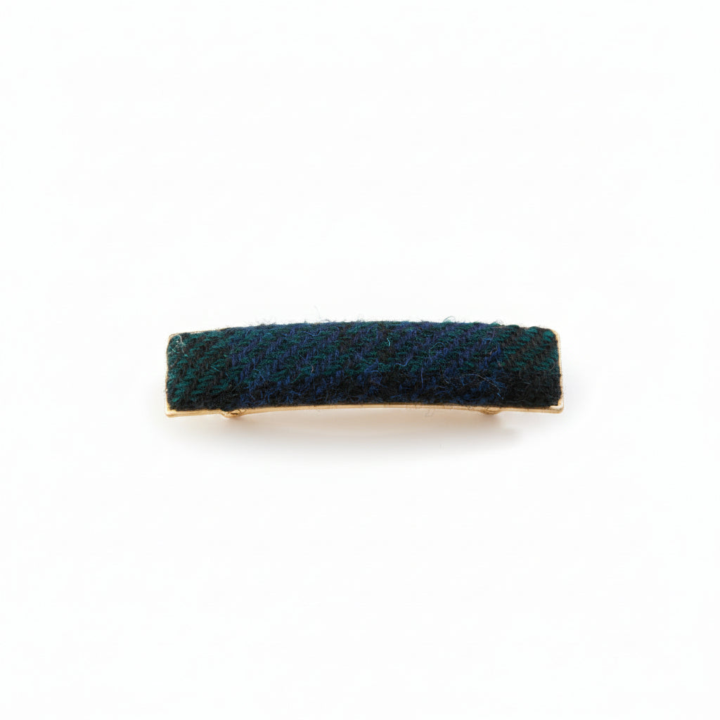 Black and grey herringbone Harris Tweed barrette on white background