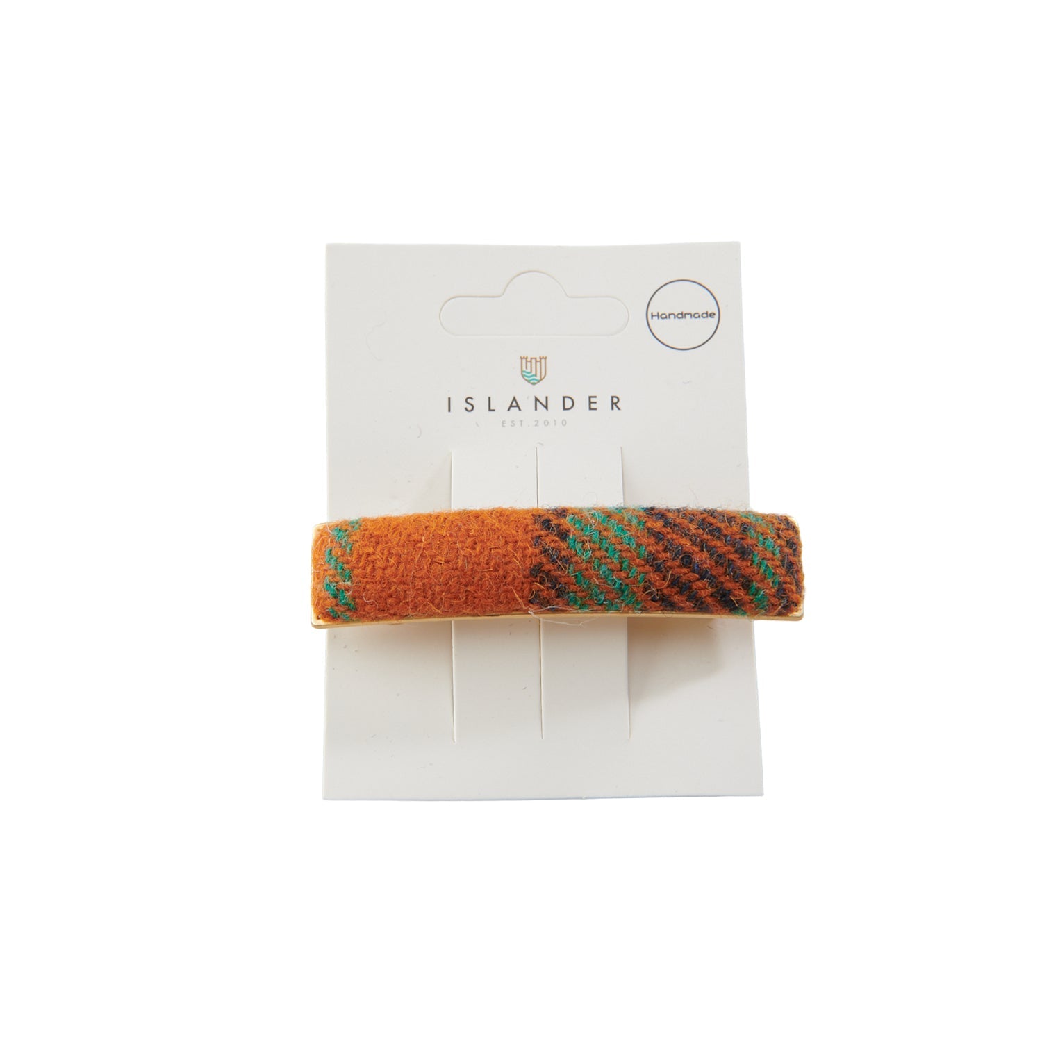 Harris Tweed orange-teal tartan hair clip on Islander branded packaging card