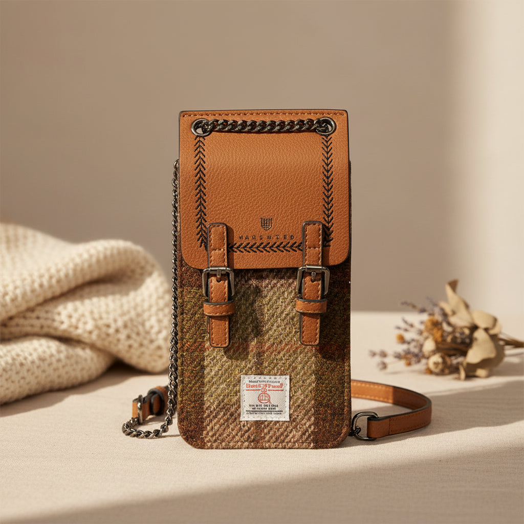 The Phone Tote with Harris Tweed® with Vegan leather and Chestnut Tartan, with a chain and leather strap.