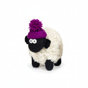 Hand-knitted wool sheep figure wearing a purple bobble hat