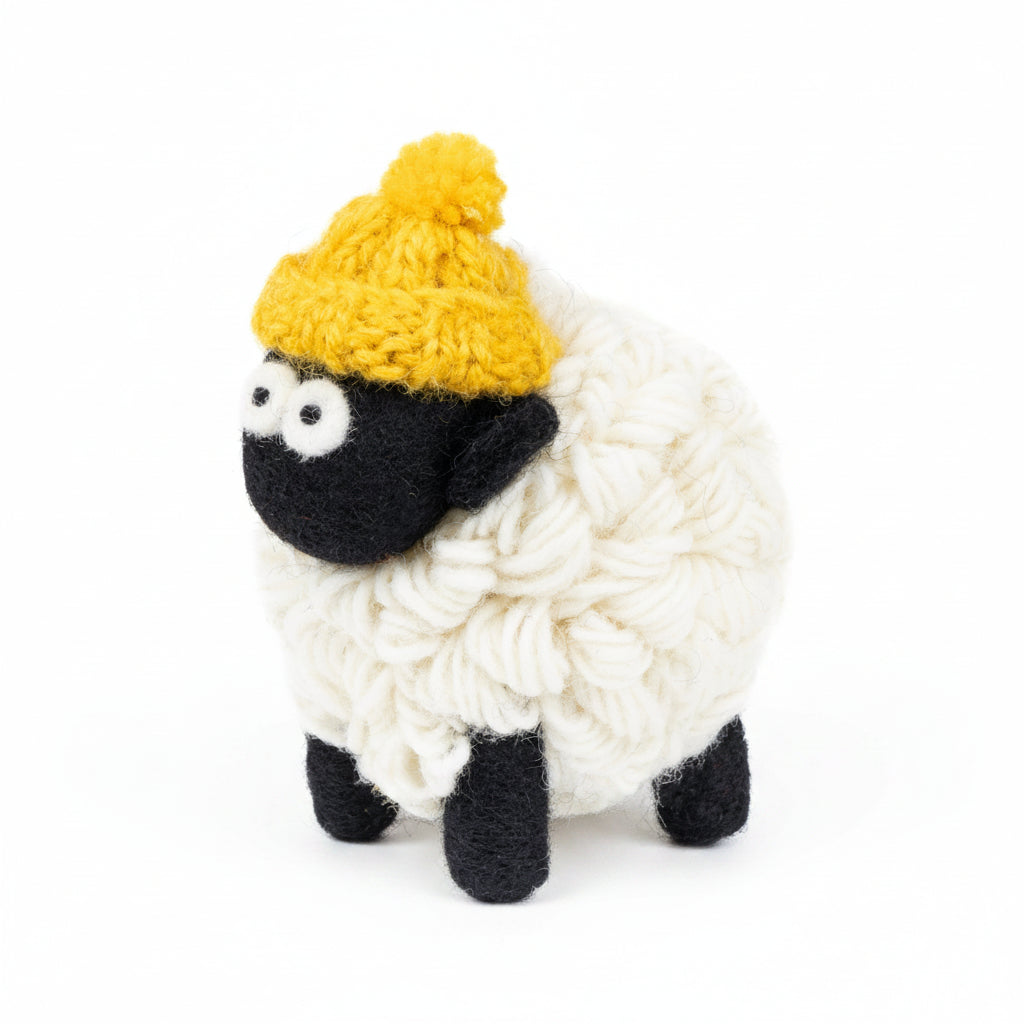 Hand-knitted wool sheep figure wearing a yellow bobble hat