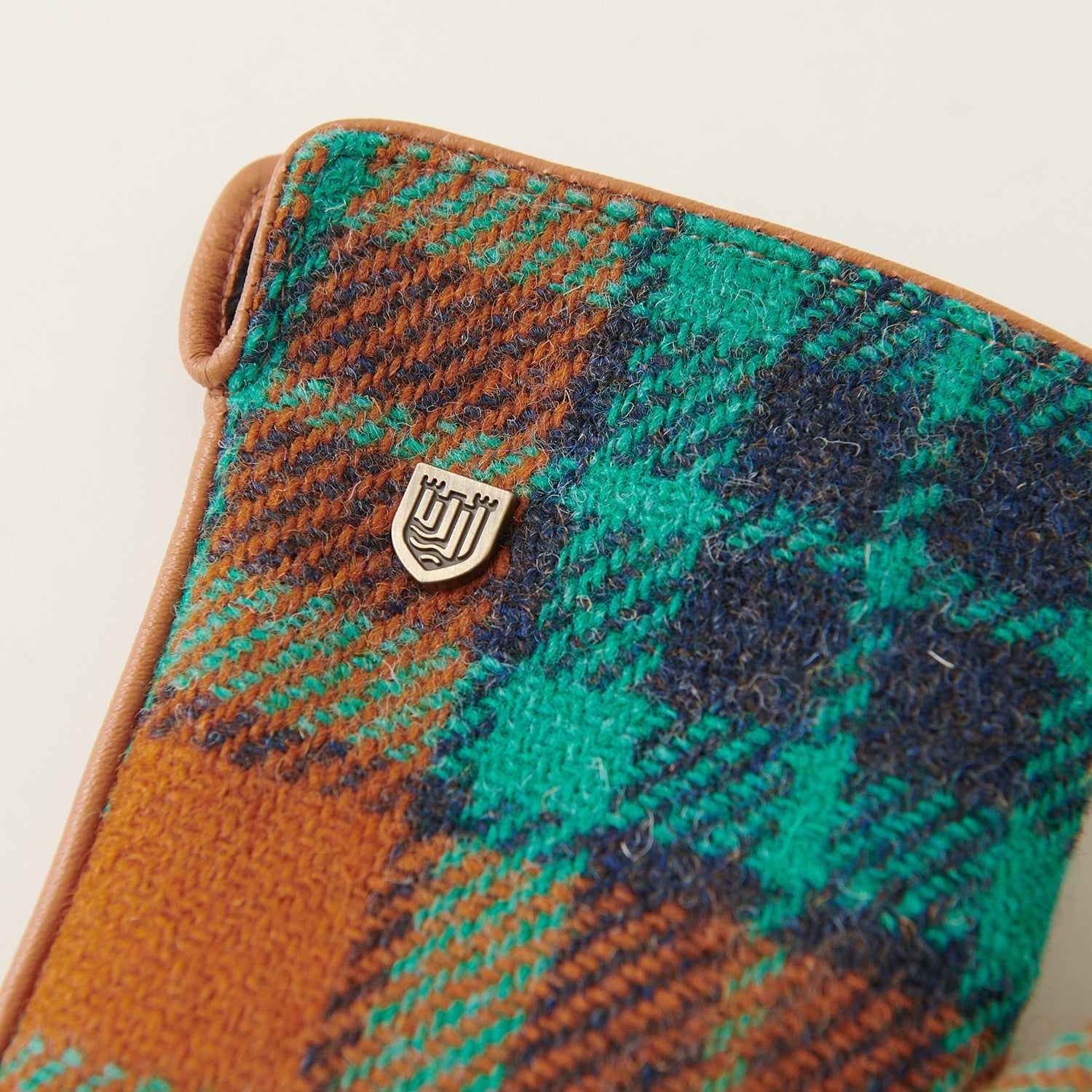 Harris Tweed weave texture close-up in orange and teal