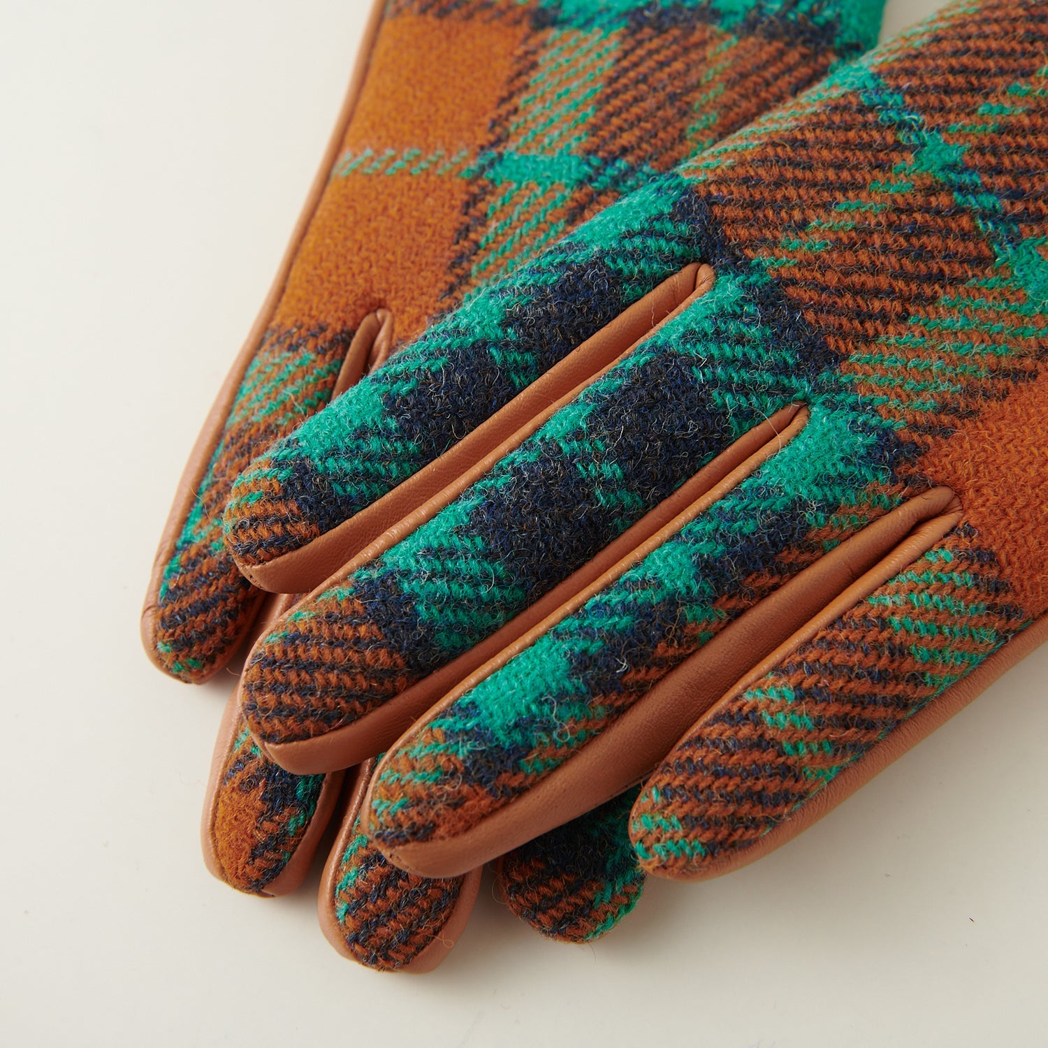 Close-up of stitching detail between Harris Tweed and leather