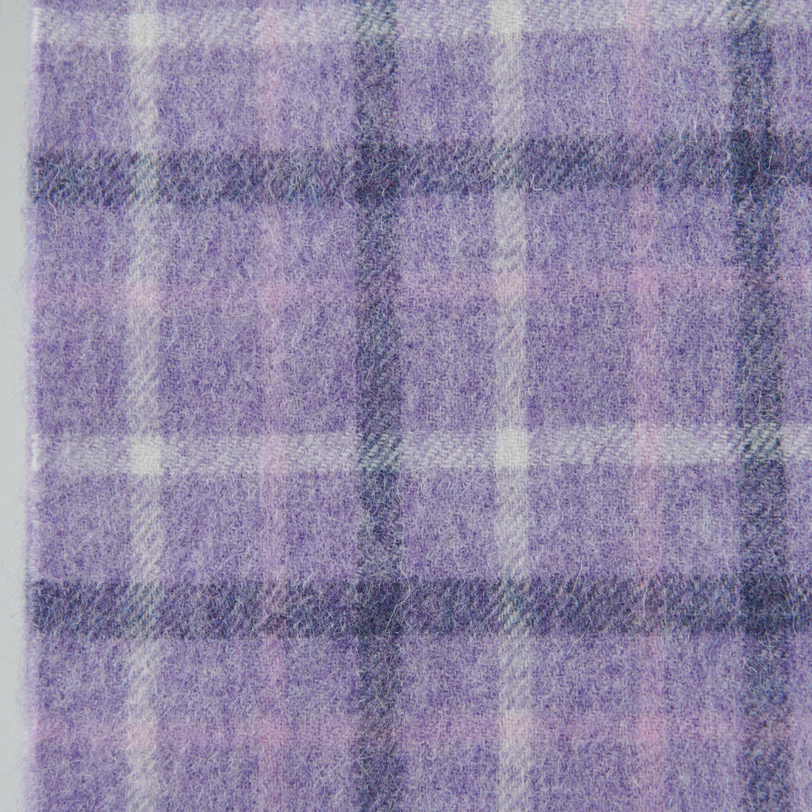 Close up of the lilac and purple tartan check in soft lambswool