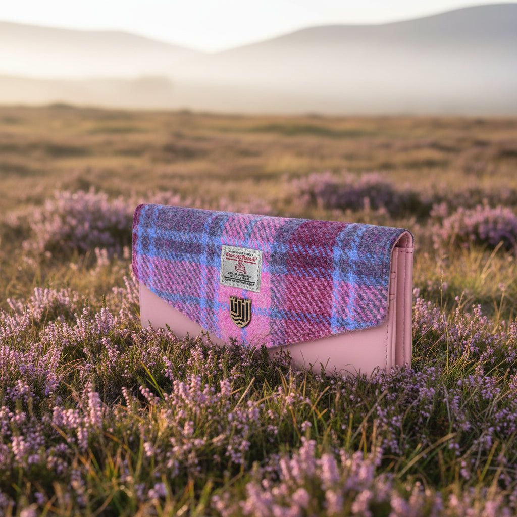 Pink and blue tartan Harris Tweed clasp purse shown at an angle