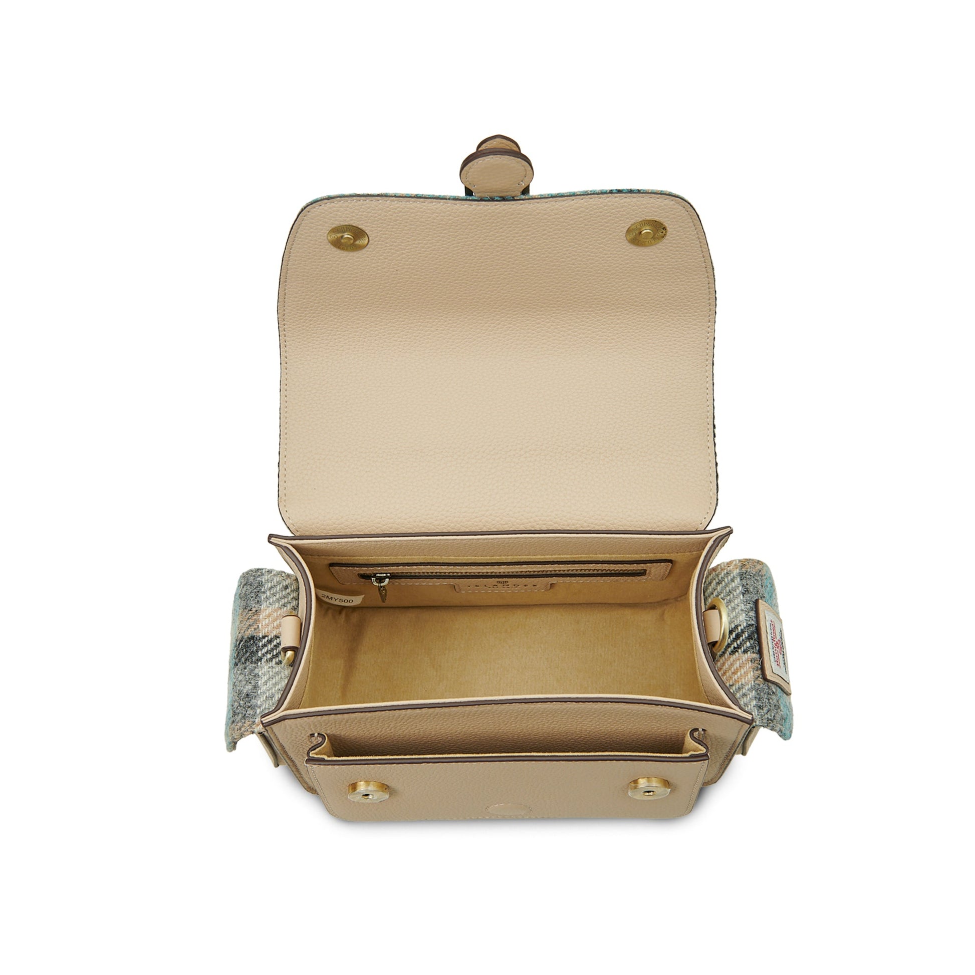 Melrose crossbody interior showing zip pocket and cream leather lining