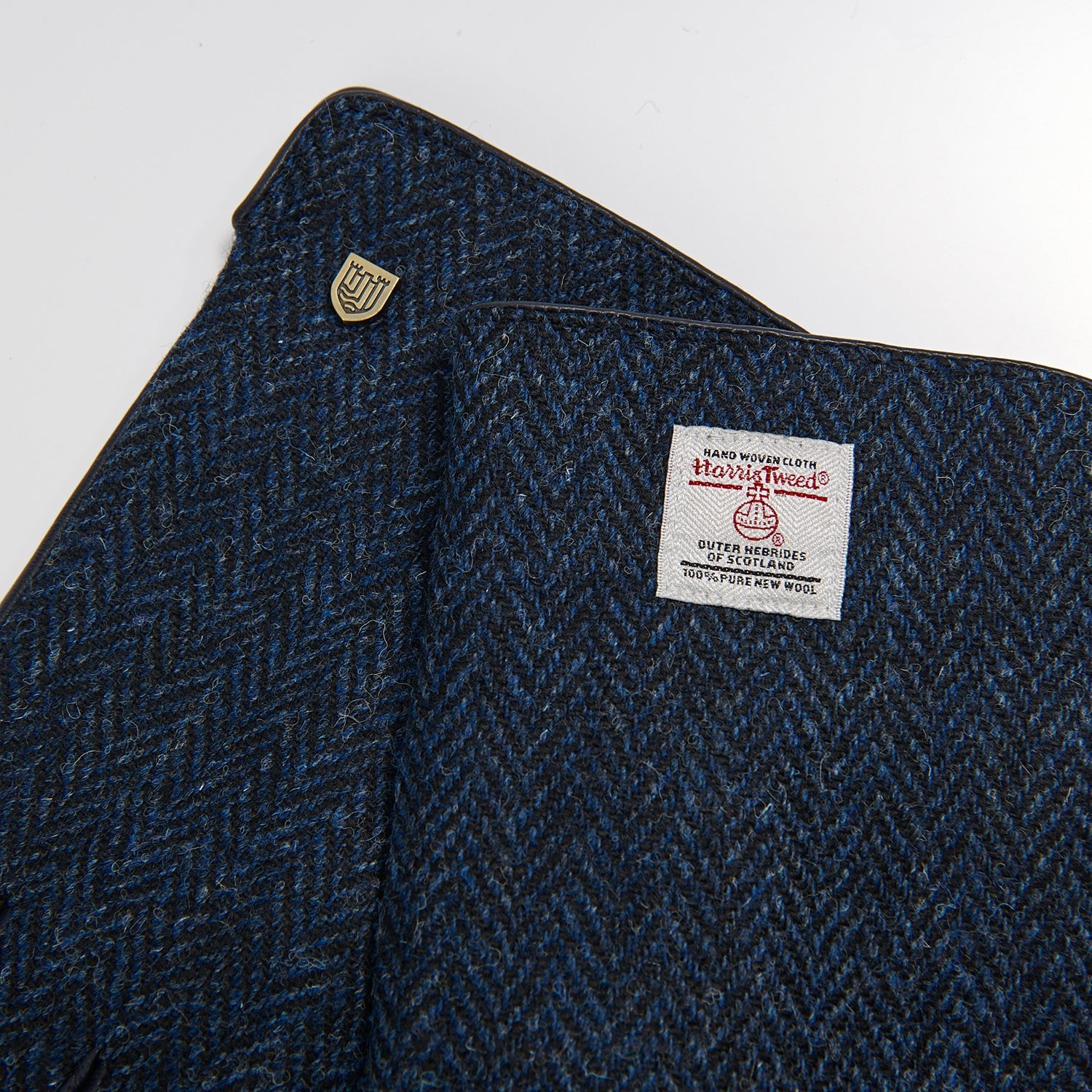 Close detail of the navy herringbone Harris Tweed glove cloth