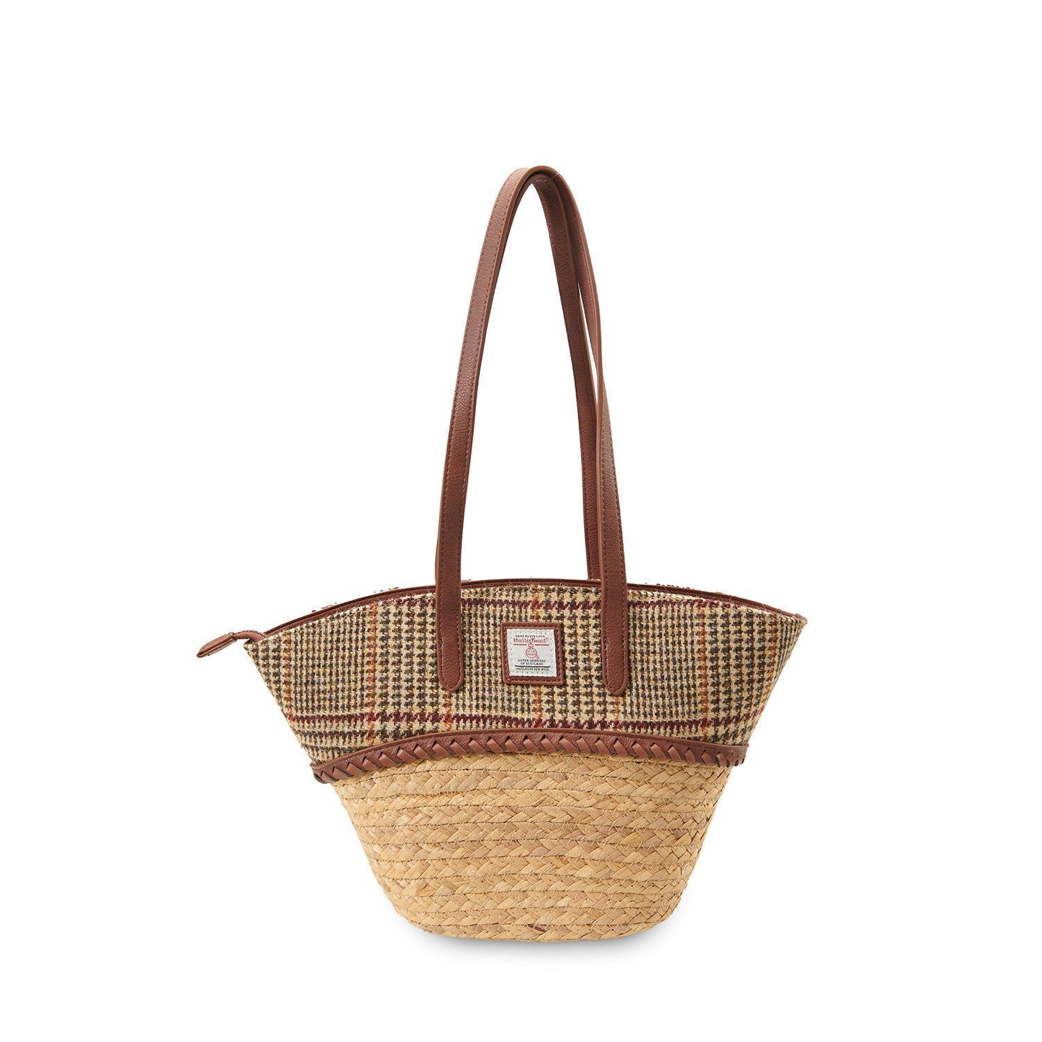 Woven straw basket bag with a beige dogtooth Harris Tweed panel and leather handles