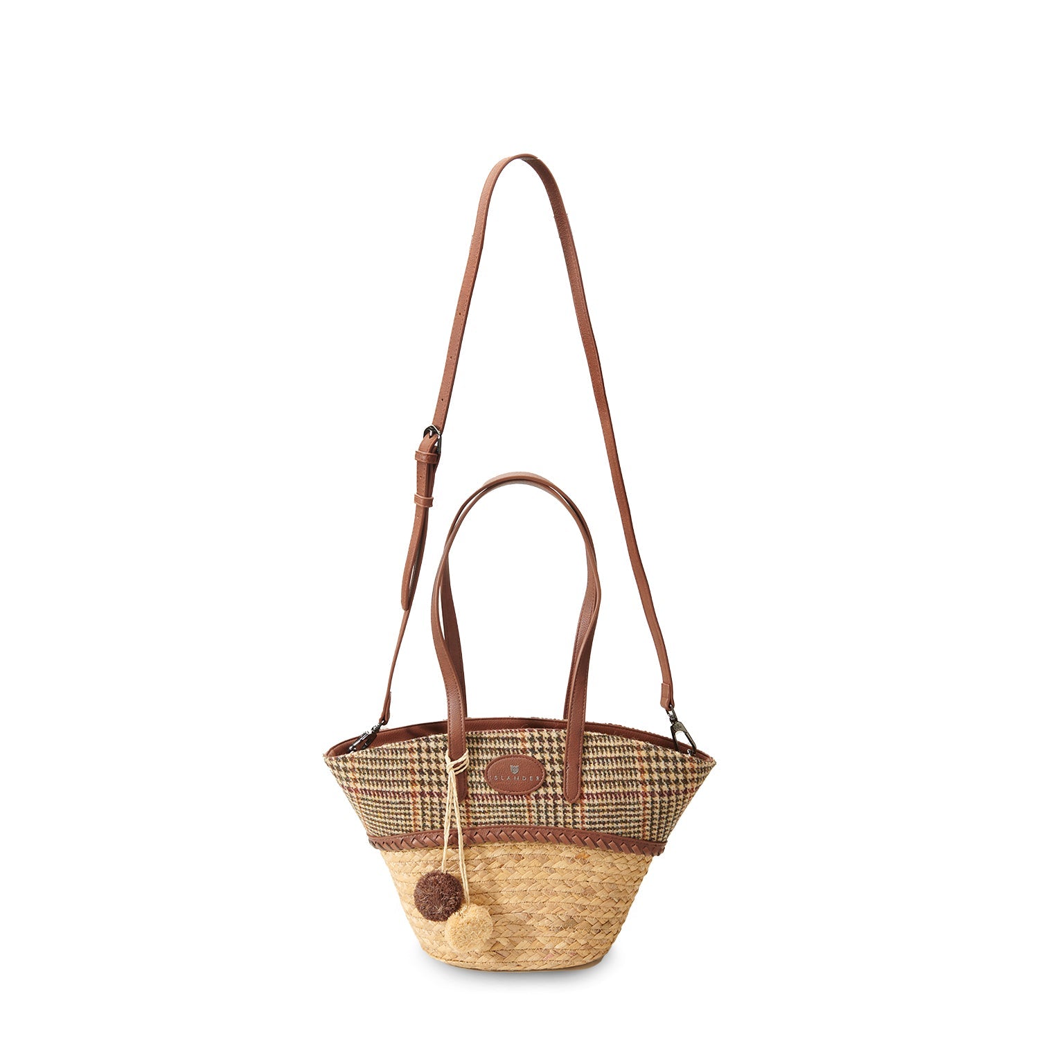 Beige dogtooth basket bag shown with the long adjustable shoulder strap