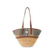 Woven straw basket bag with an Islander check Harris Tweed panel and leather handles