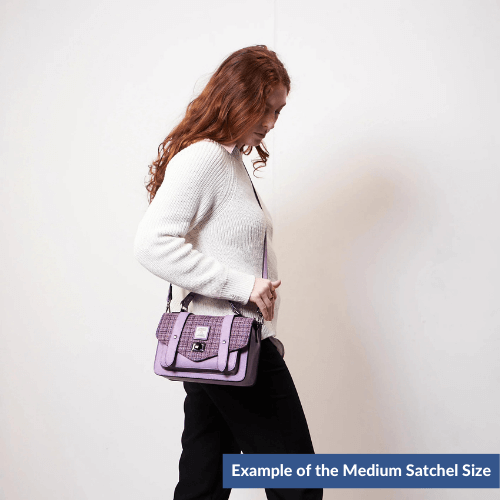 Example of a lady wearing a medium Harris Tweed satchel.