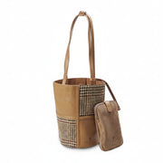 Beige dogtooth Harris Tweed bucket bag front view with phone pouch