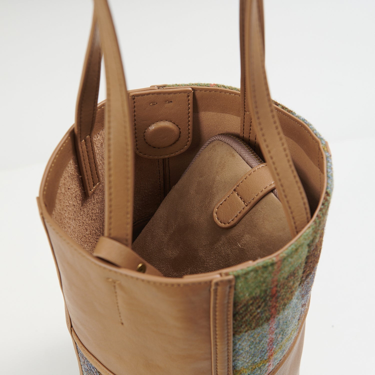 Orlagh chestnut-blue tartan bucket bag interior view with phone pouch stored