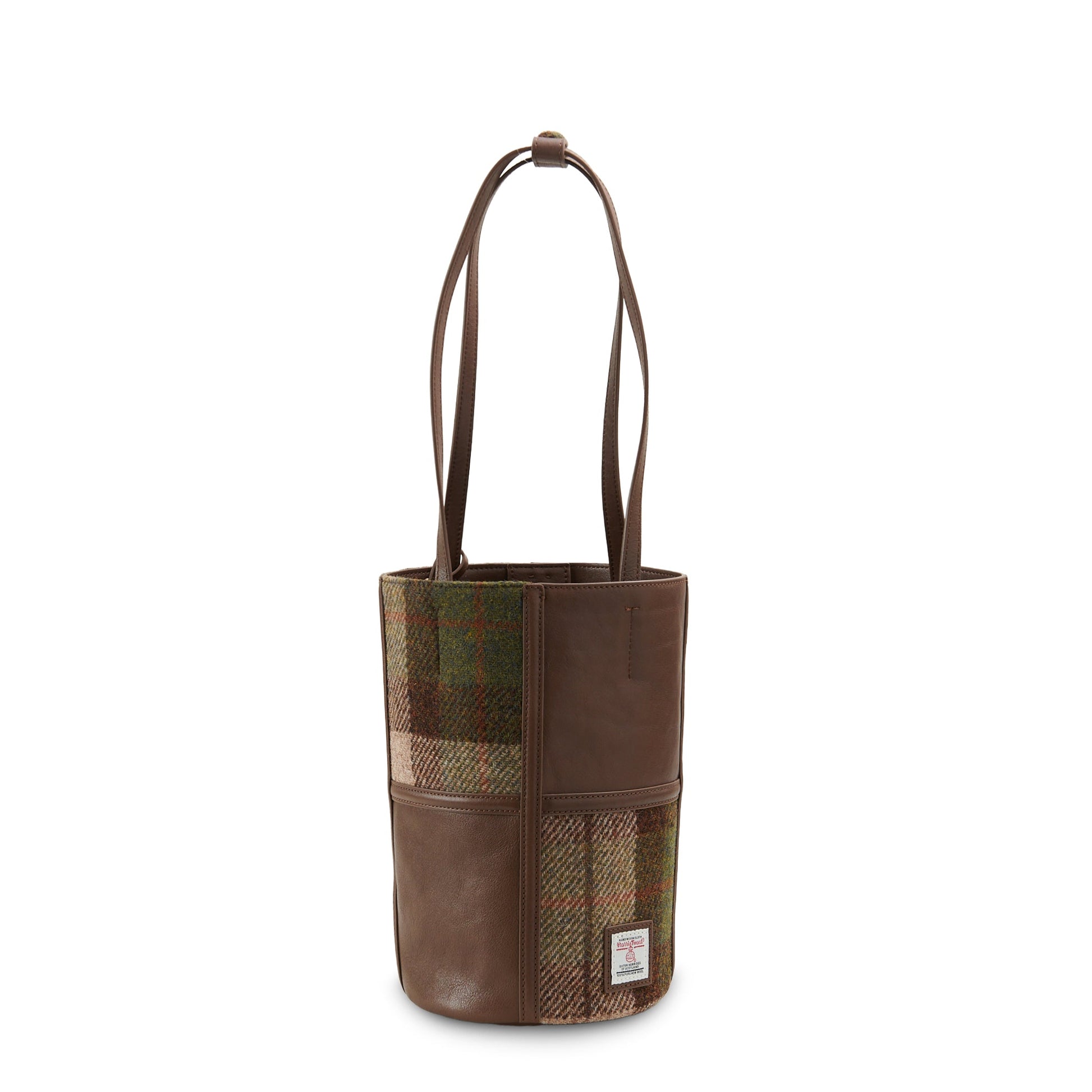 Chestnut tartan Harris Tweed bucket bag angled view showing tweed texture