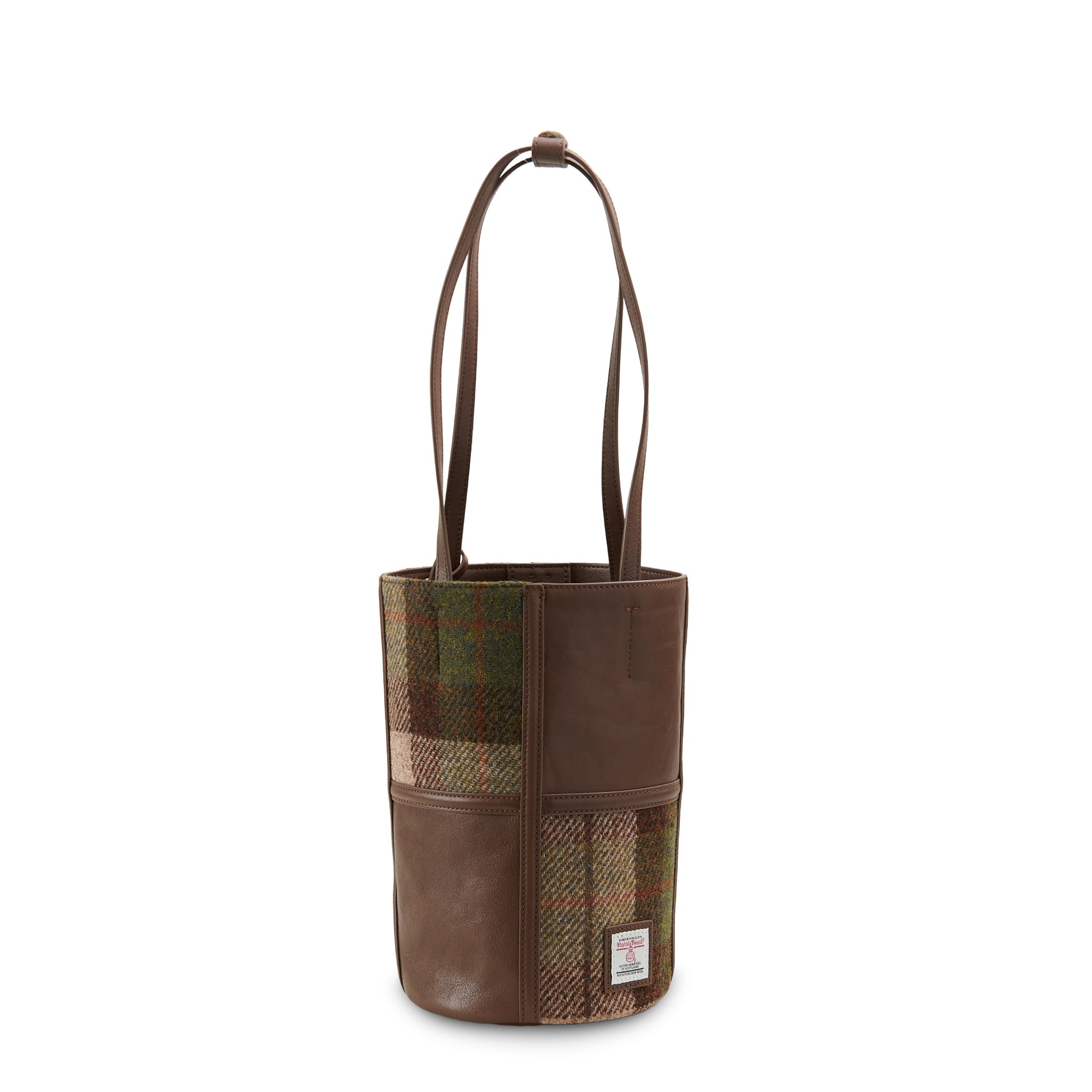 Chestnut tartan Harris Tweed bucket bag angled view showing tweed texture