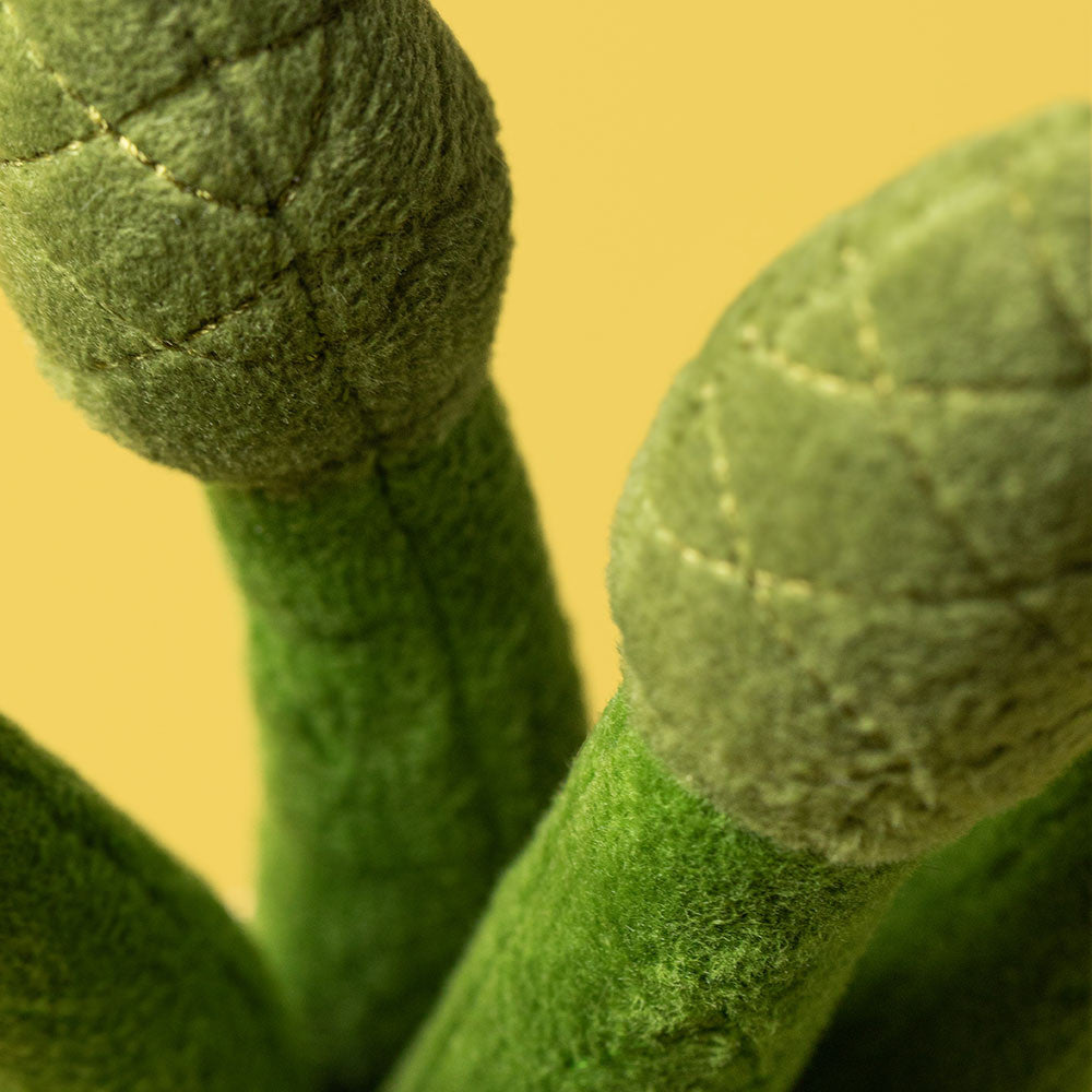 Amuseables Asparagus soft toy angled view on white background