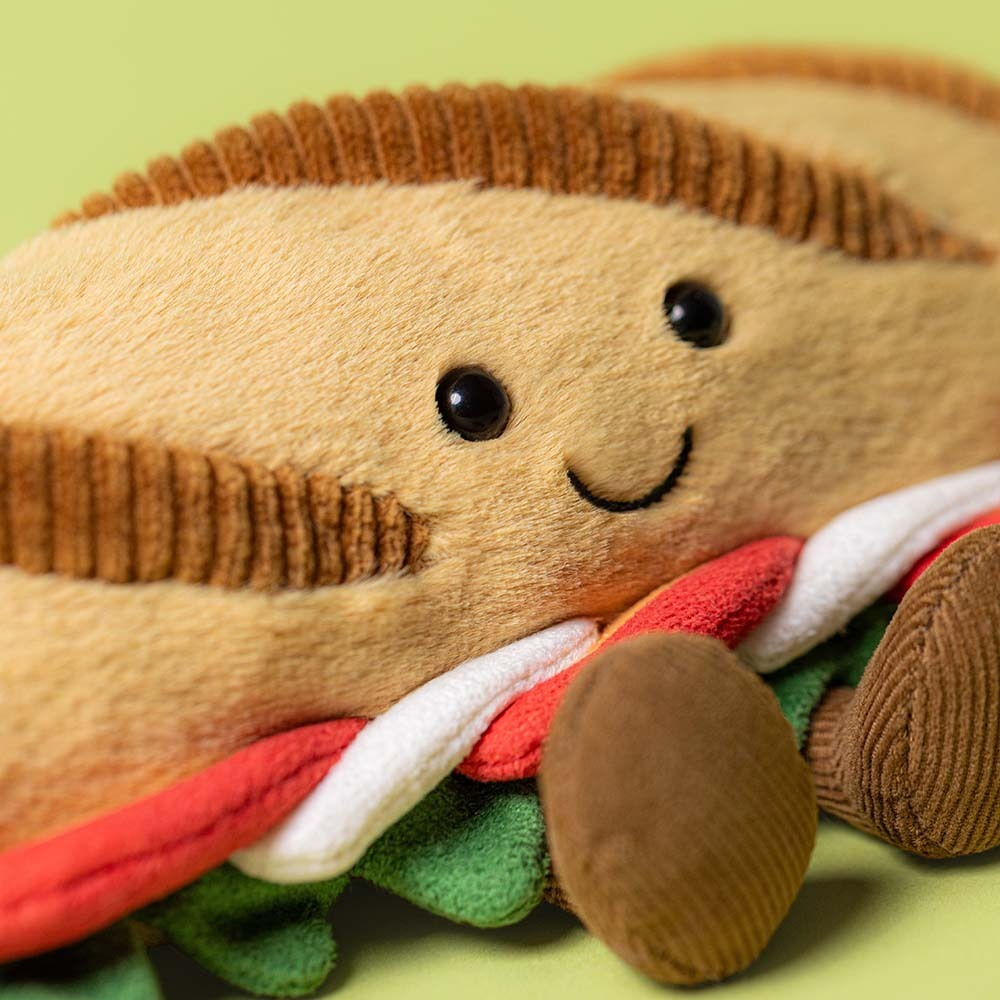 Close-up of Caprese Baguette face and filling on green background