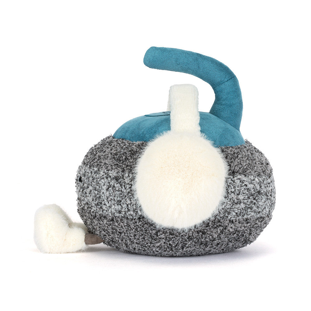 Cariss Curling Stone side view with white pom-pom earmuff