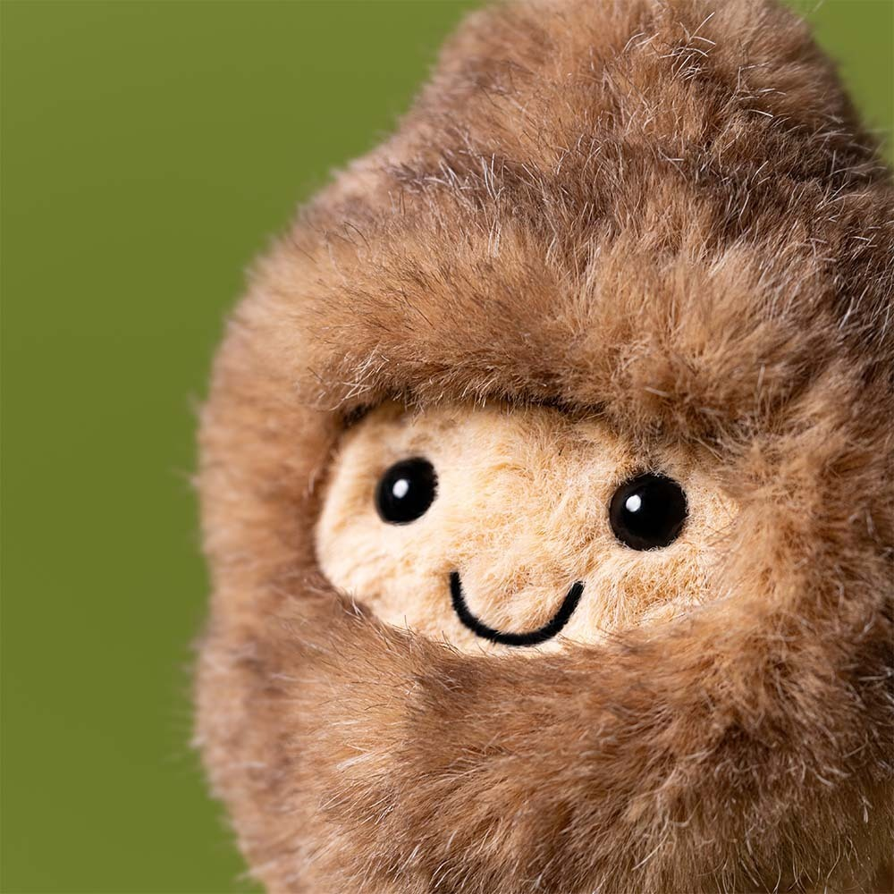 Jellycat Amuseables Peanut Yeti soft toy in a fluffy white yeti outfit
