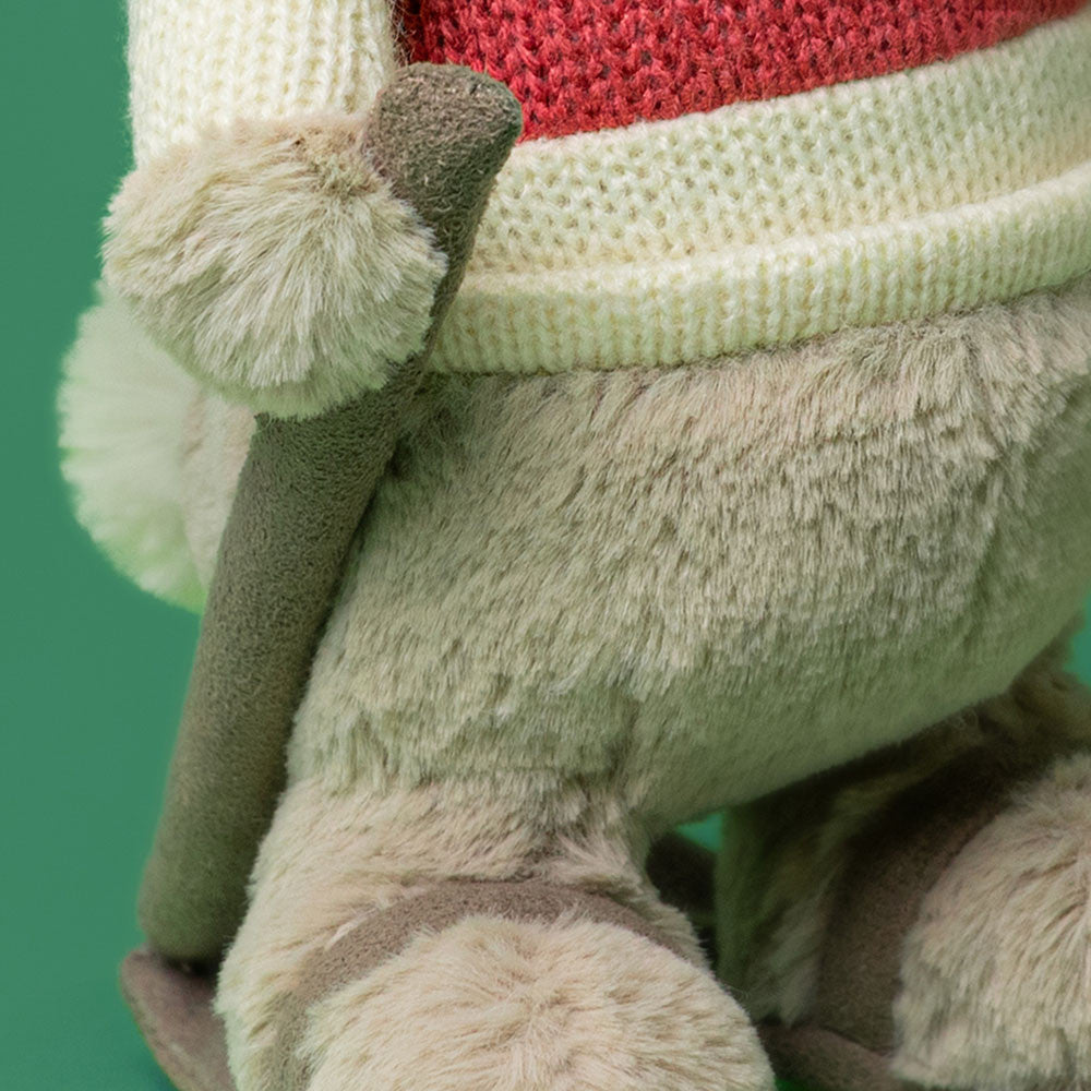 Jellycat Bashful Bunny close-up of ski pole on green background