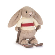 Jellycat Bashful Bunny soft toy skiing on white background