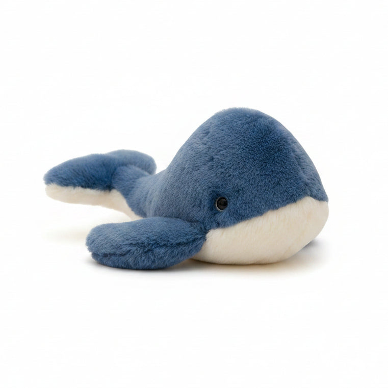 Jomanda blue whale plush soft toy, 28cm, with a deep ocean blue back, cream belly and tail turned upwards.