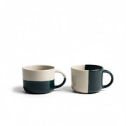 Two sea green dipped Rue mugs on a white background