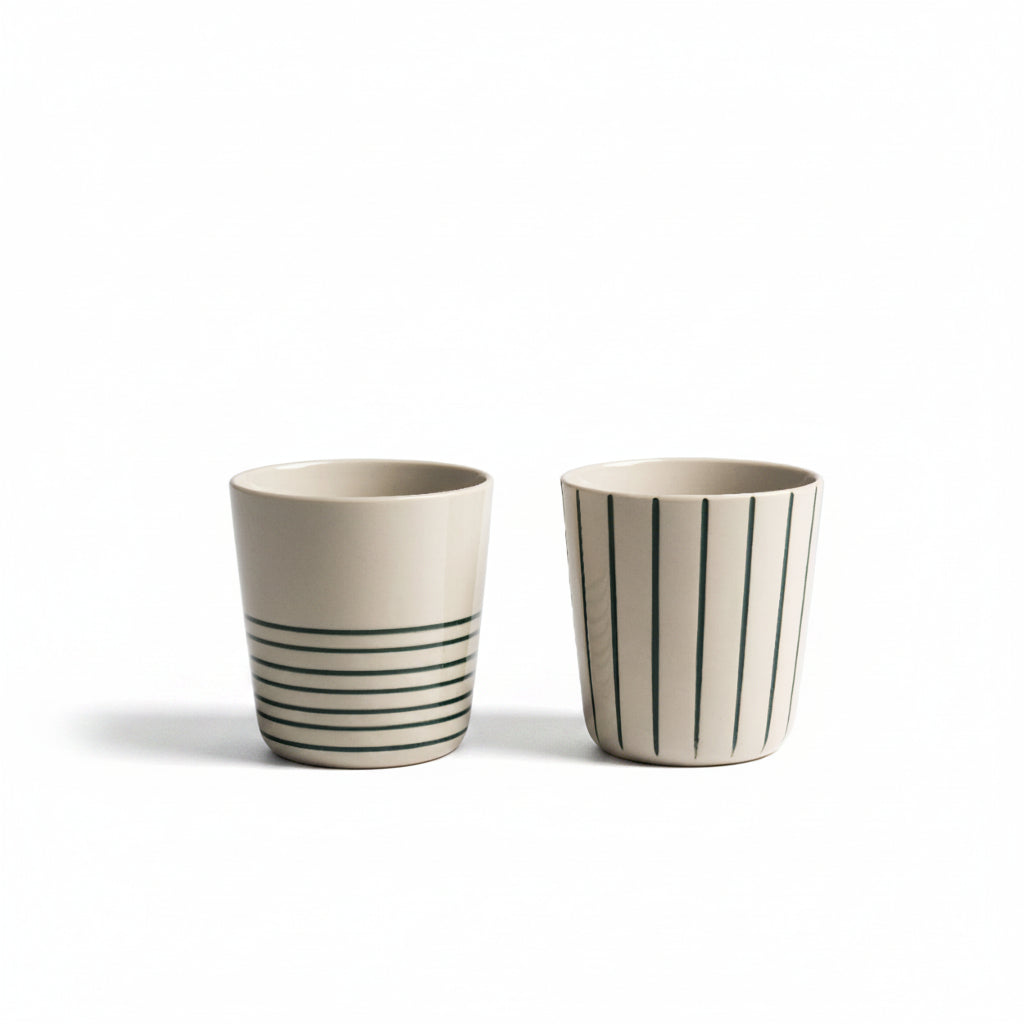 Two sea green hand-etched Sorrel beakers on a white background