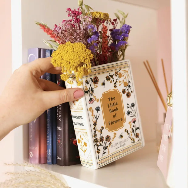 Little Book of Flowers vase on bookshelf with real books lifestyle shot