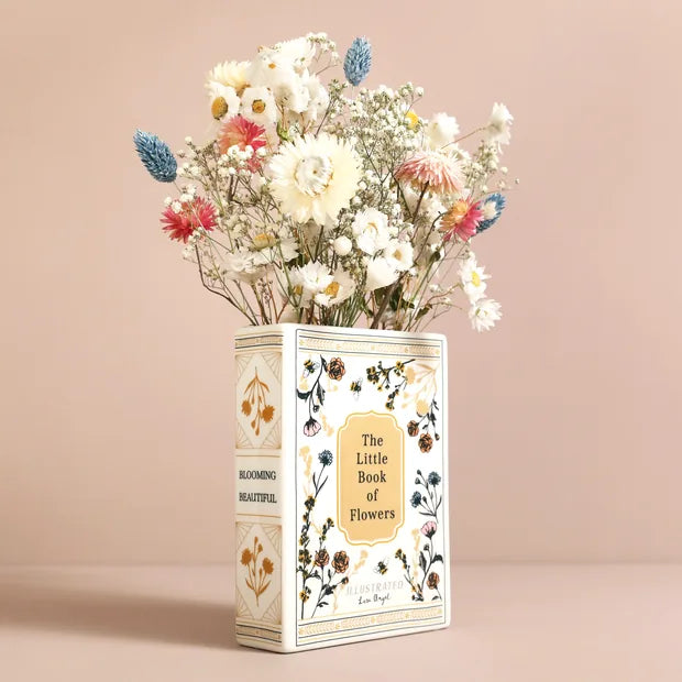 Ceramic book vase with dried flowers showing front cover and spine detail