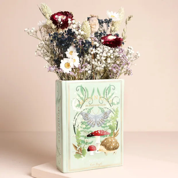 Moonrise woodland book vase with dried flowers on beige background - front view