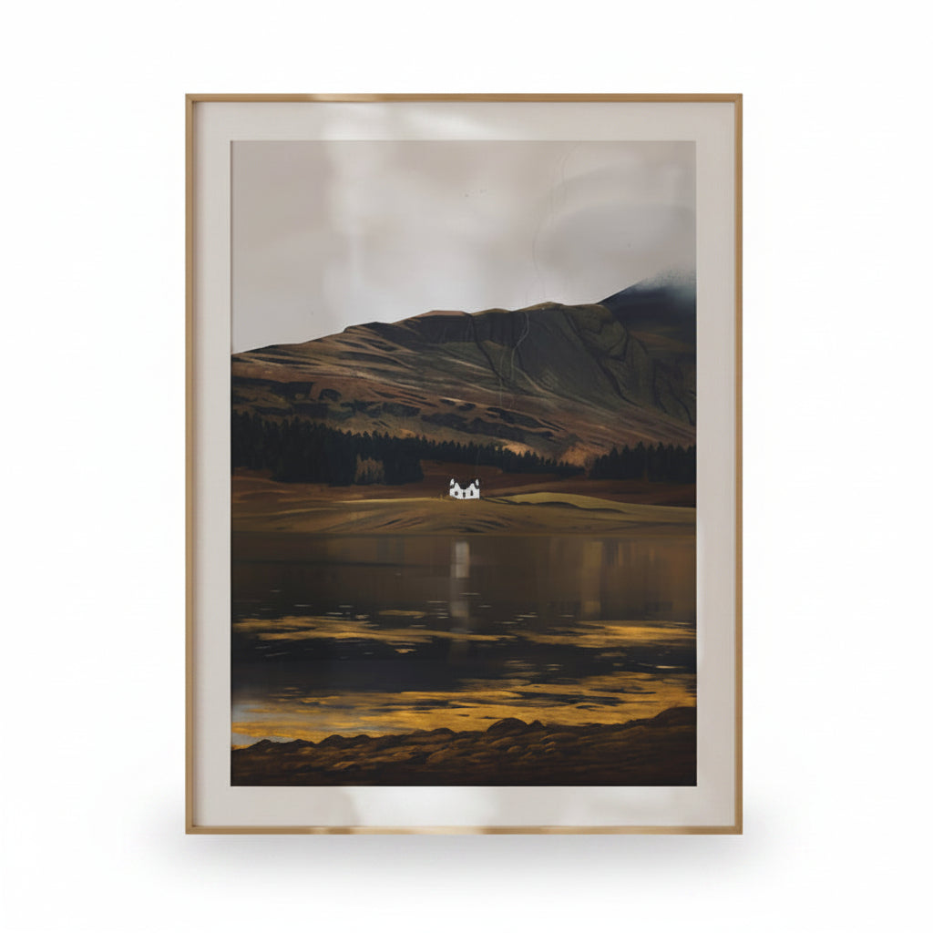 Framed artwork of a mountain landscape with a house on a lake, on a beige wall.