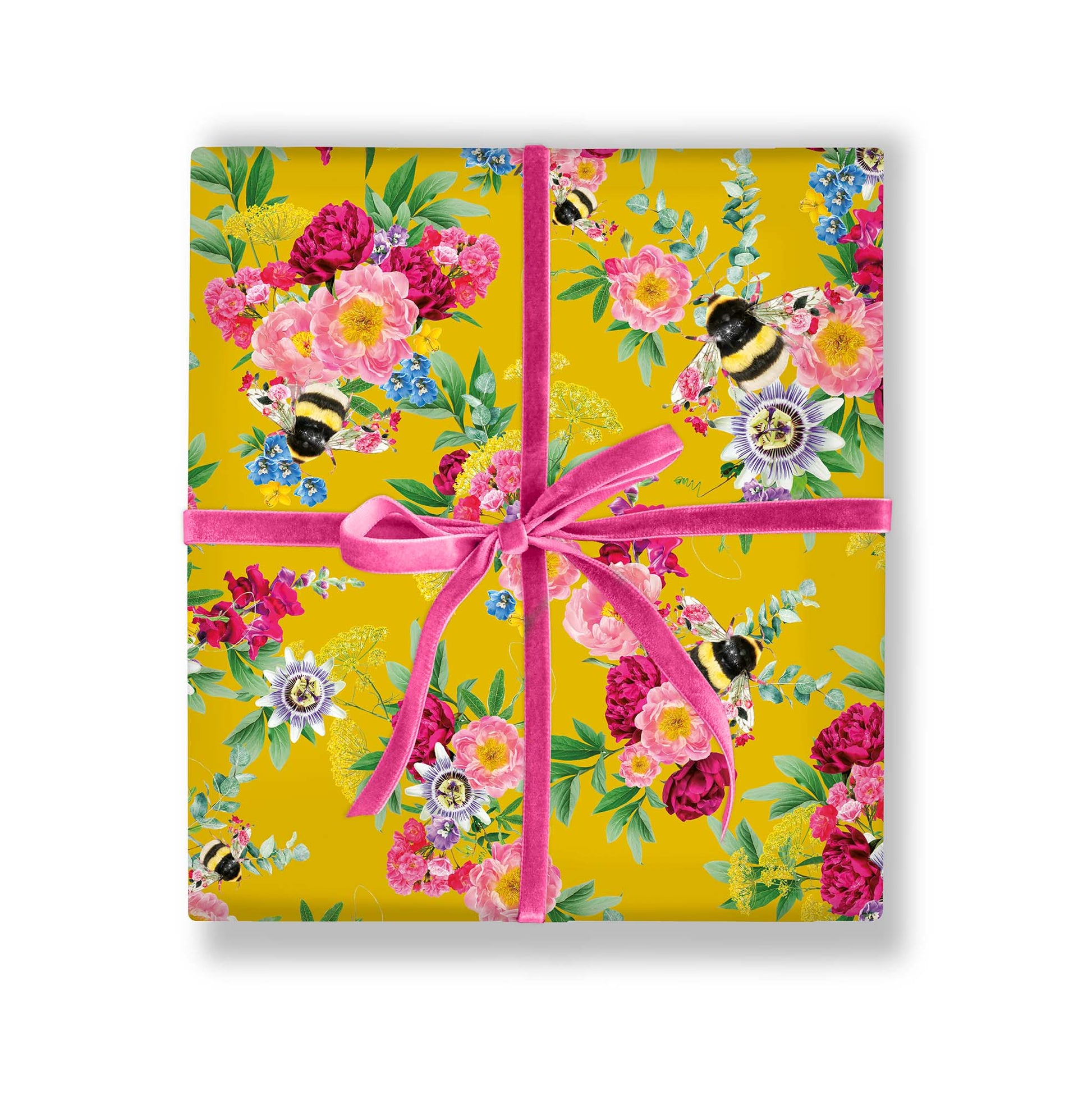 Botanical bee gift wrap styled wrapped around a gift
