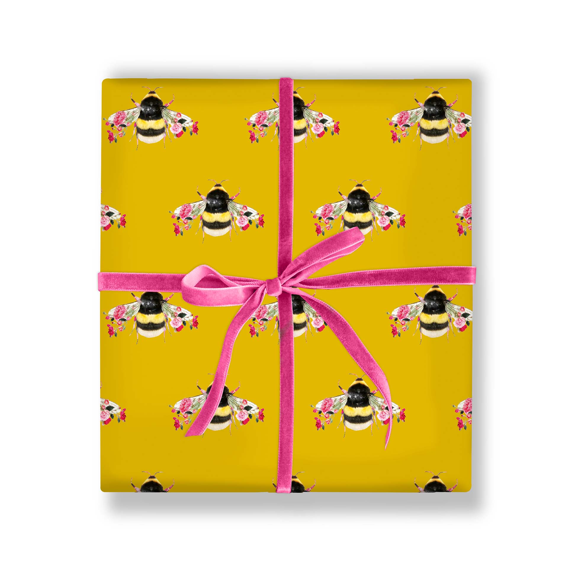 Gift wrapped in botanical bee paper with ribbon