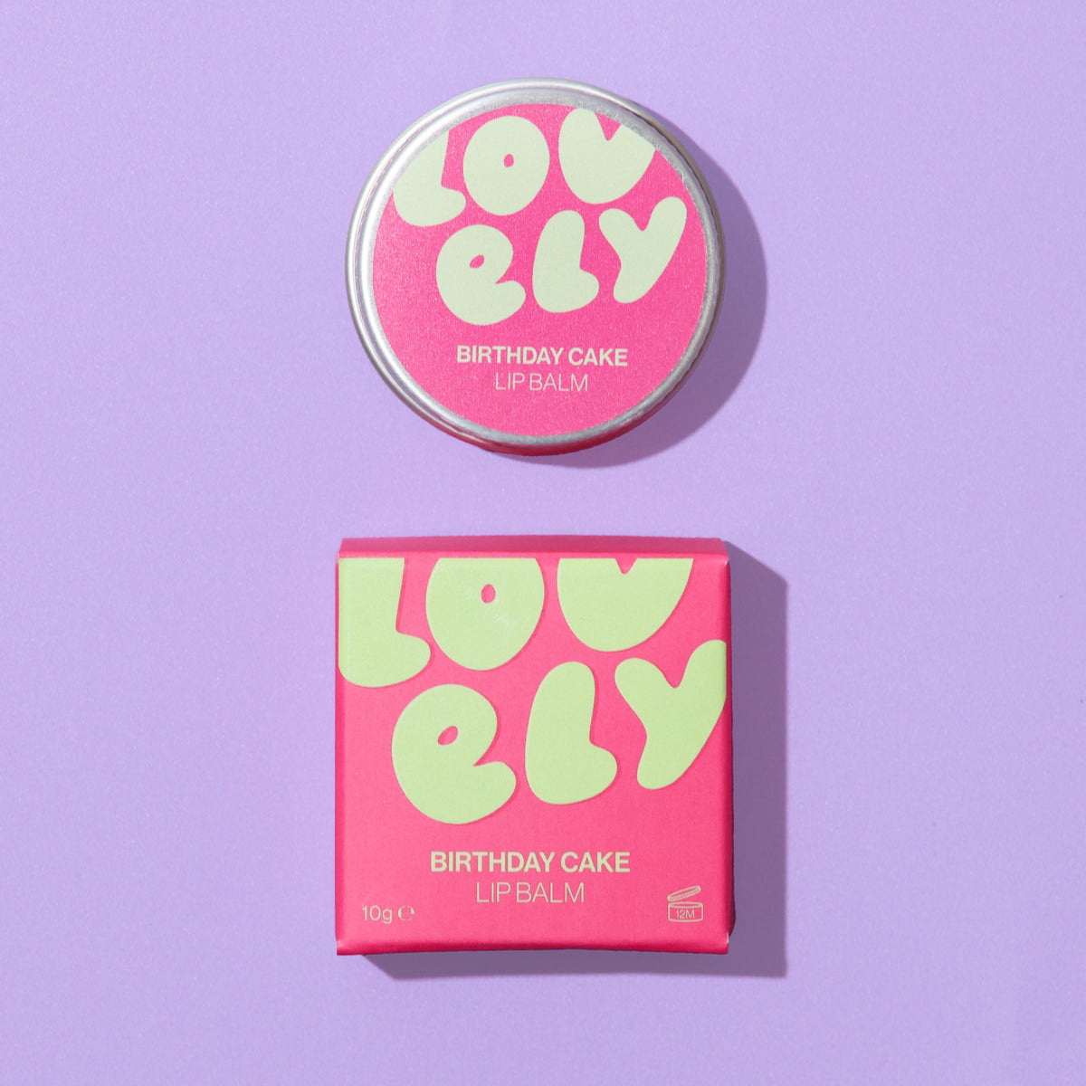Birthday Cake lip balm tin and box on a lilac background