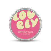 Hand holding the Birthday Cake lip balm tin