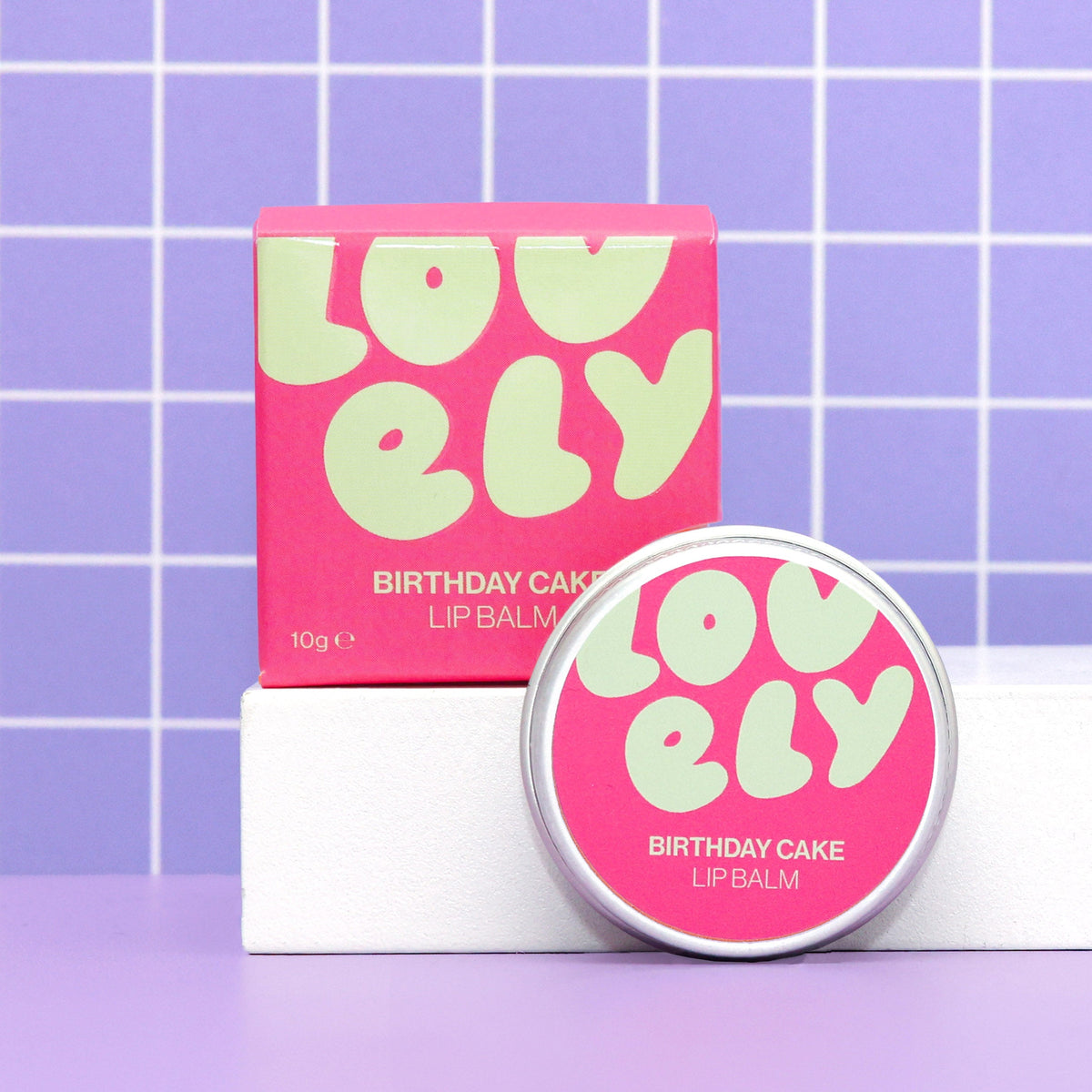 Birthday Cake lip balm tin and box by Lovely Skincare styled lifestyle view