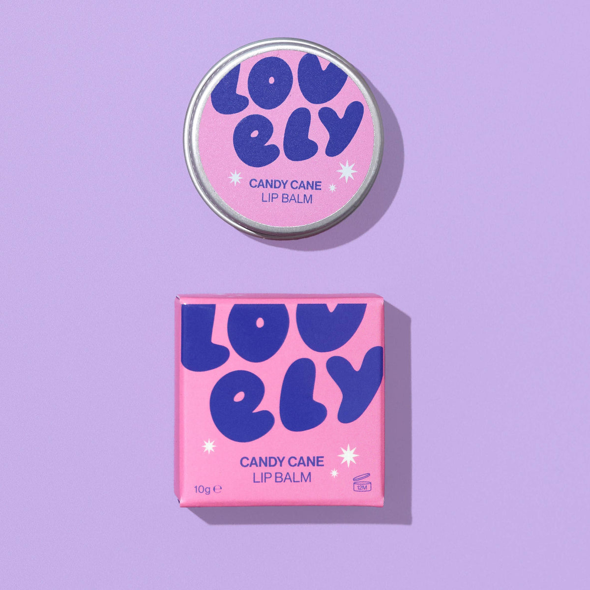 Candy Cane lip balm tin and box on a lilac background