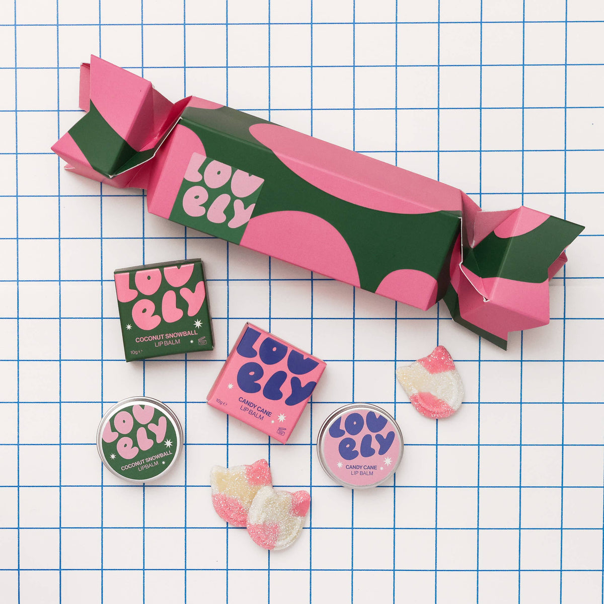 Christmas cracker gift set contents on a white grid