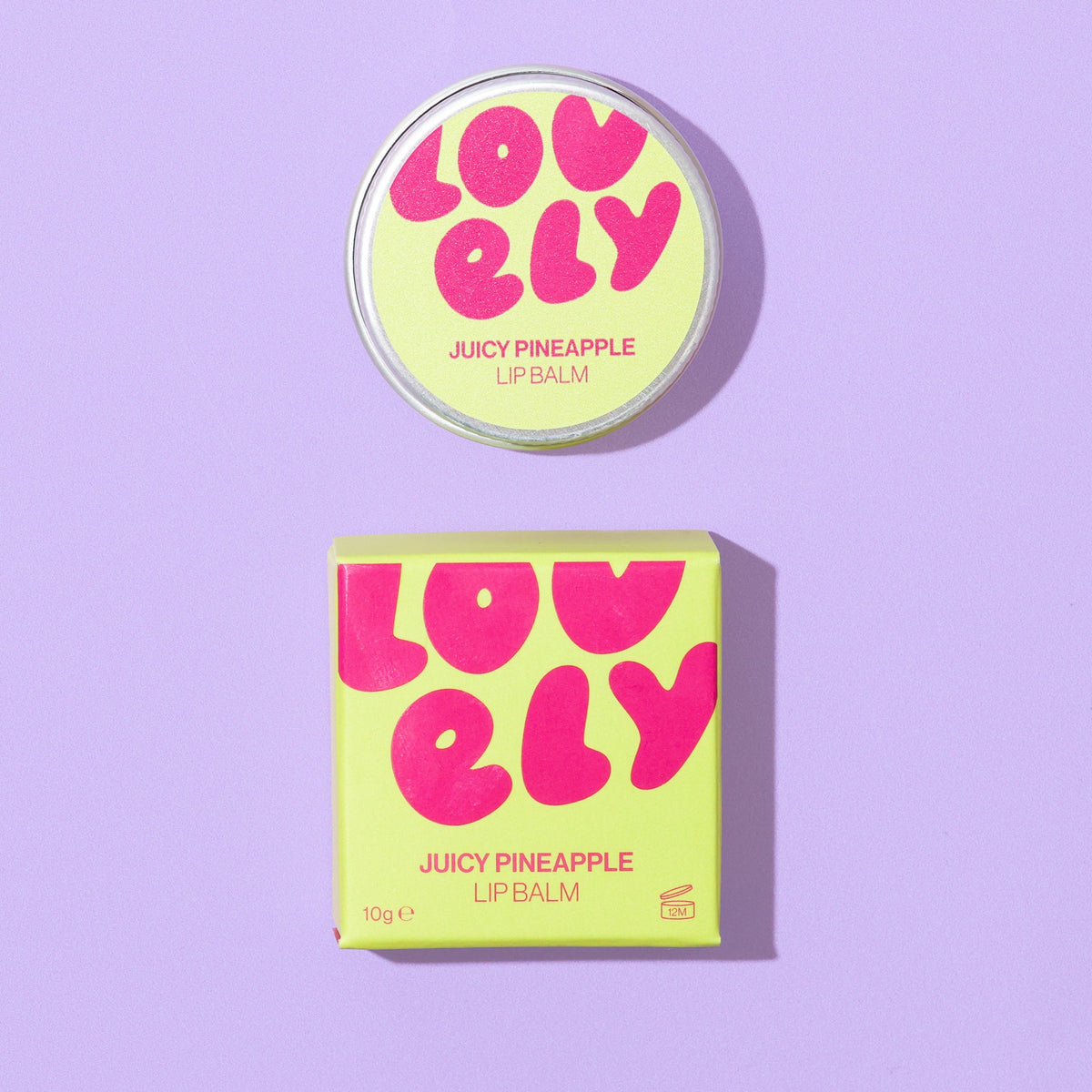 Juicy Pineapple lip balm tin and box on a lilac background